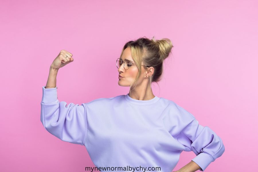 photo-of-a-confident-woman-flexing-muscle
