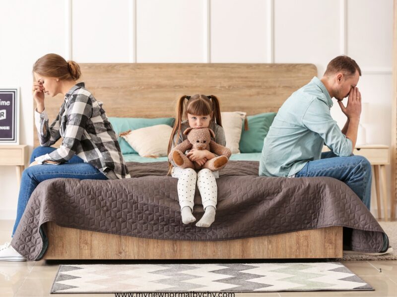 photo-of-a-sad-family-of-three-a-man-his-wife-and-child-sitting-on-the-bed-after-arguing