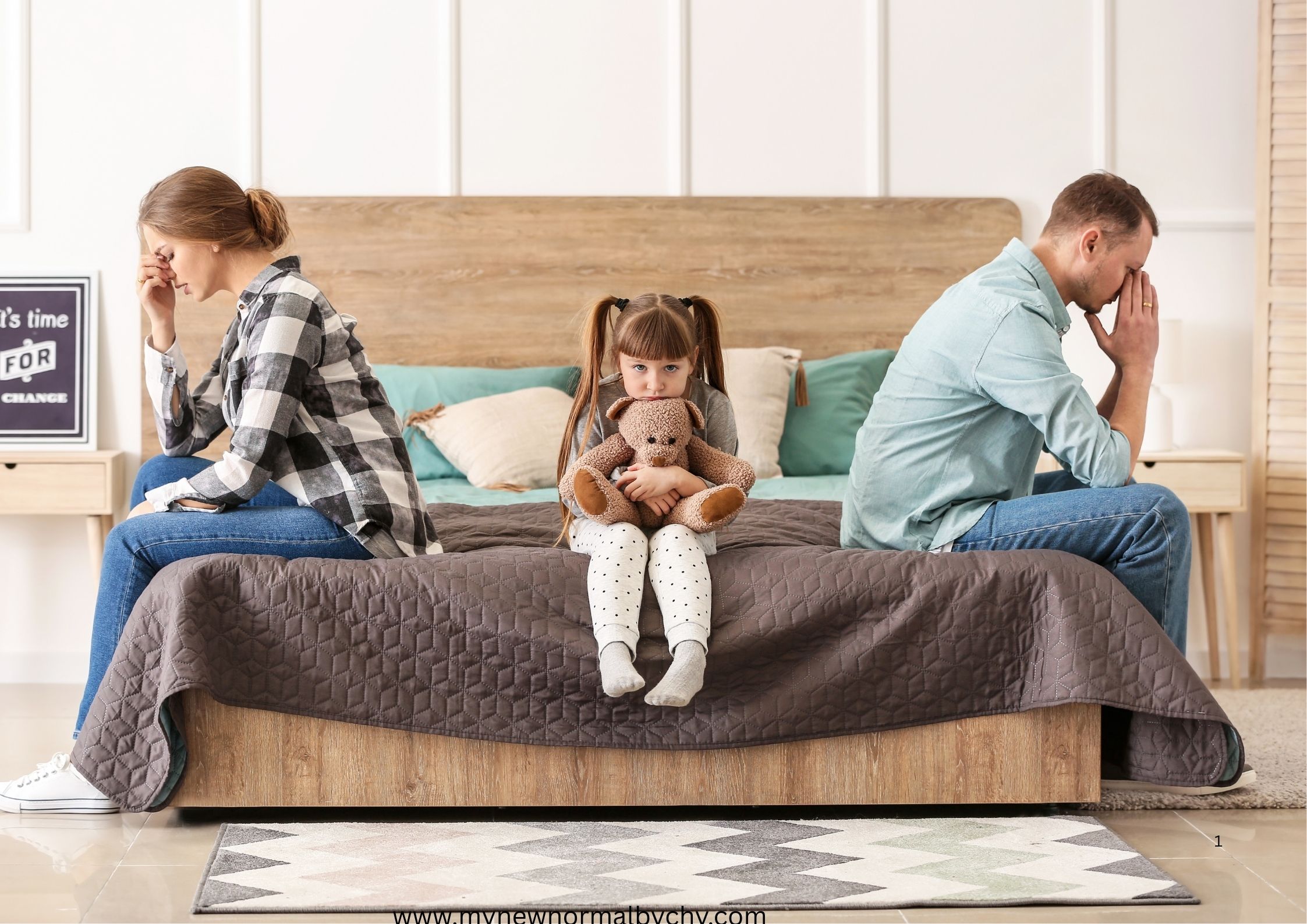 photo-of-a-sad-family-of-three-a-man-his-wife-and-child-sitting-on-the-bed-after-arguing