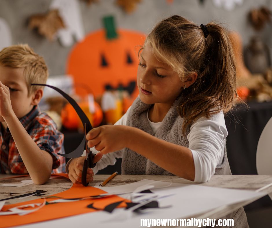 toddler-girl-making-halloween-crafts-at-home