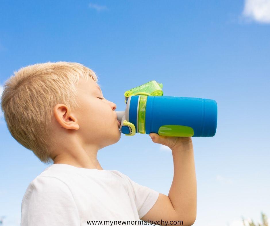 a-boy-drinking-water-from-a-water-bottle-outdoor