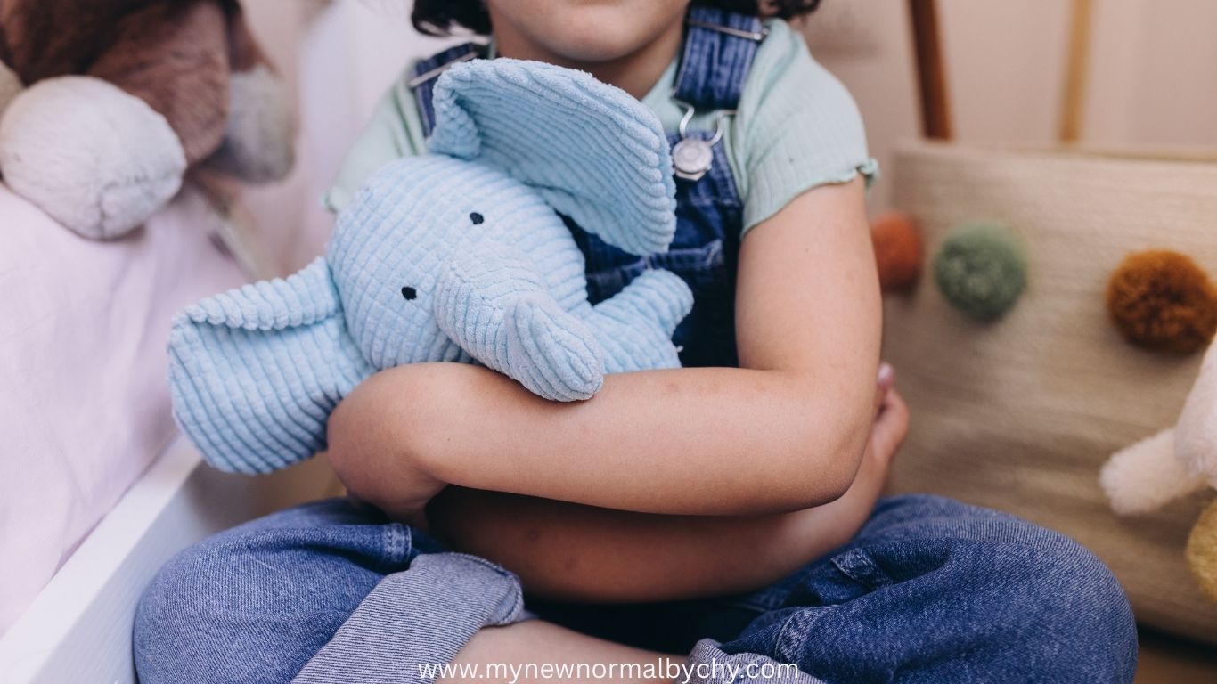 a-child-holding-a-stuffed-animal-how-to-prepare-toddlers-for-their-first-day-of-school
