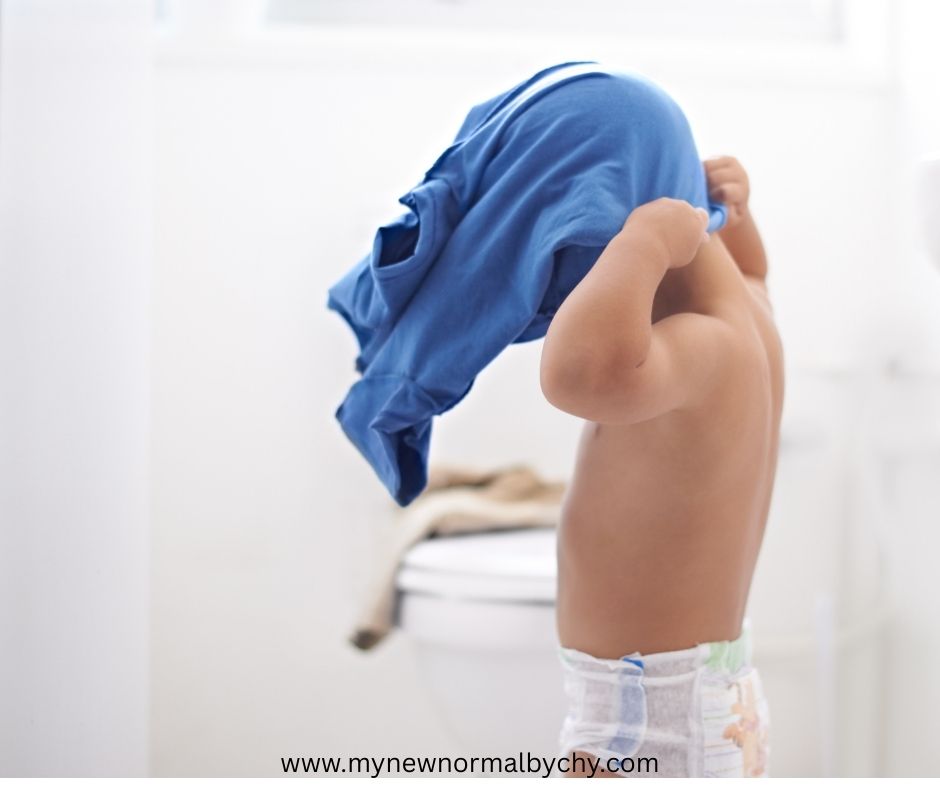 toddler-helping-out-in-the-morning-by-dressing-himself-up