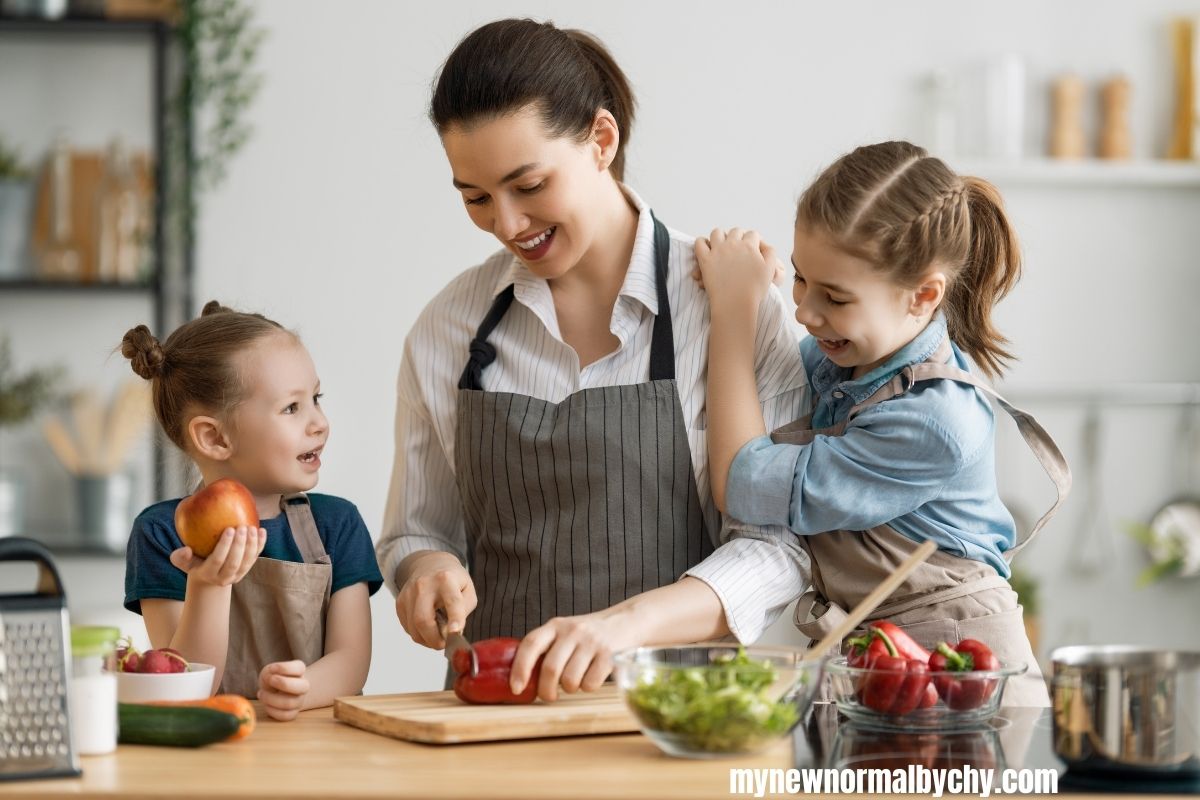 two-young-girls-helping-their-mom-in-the-kitchen-while-they-pratice-phonics-10-easy-phonics-practice-ideas-for-busy-parents-that-actually-works