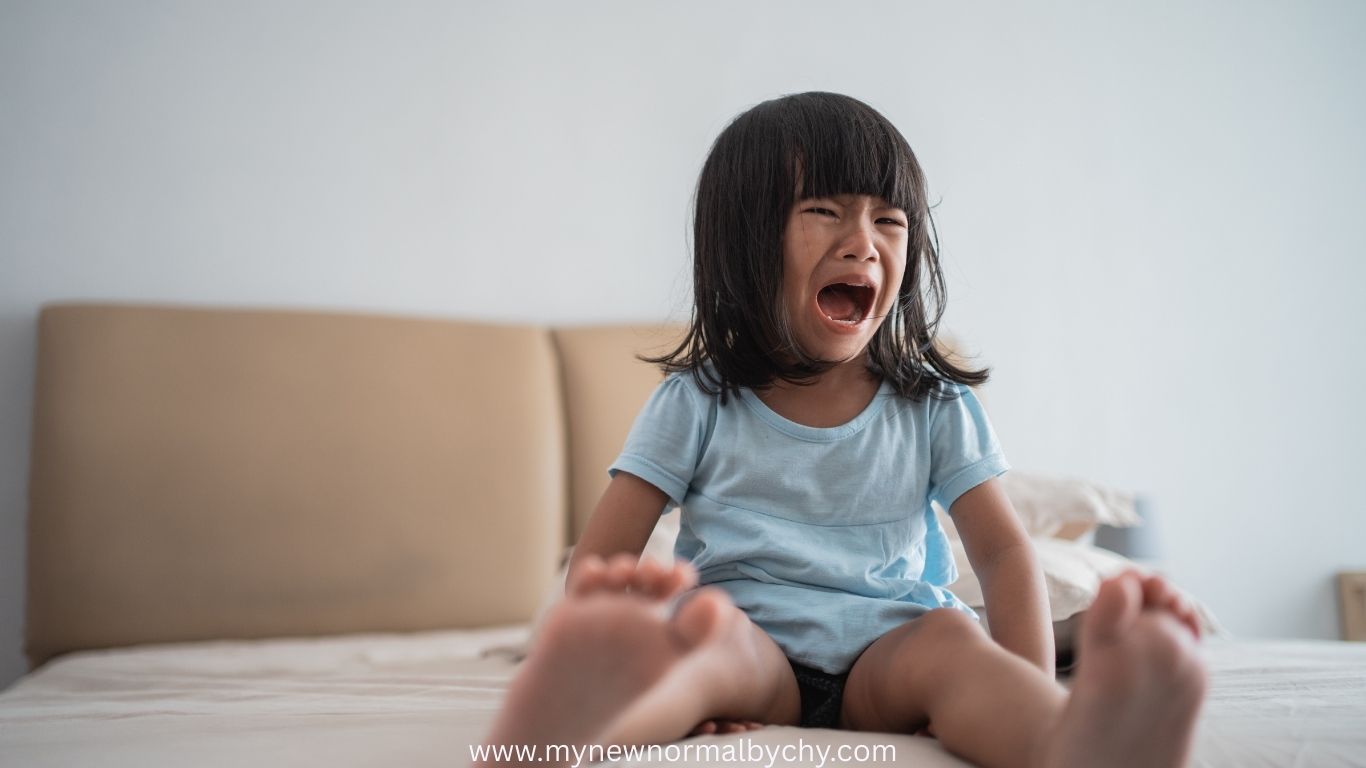 strong-screaming-by-a-toddler-sitting-on-the-bed-how-to-reset-a-toddlers-sleep-schedule