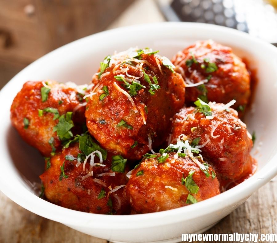 a-white-bowl-of-meatballs-with-vegetable-sprinkles