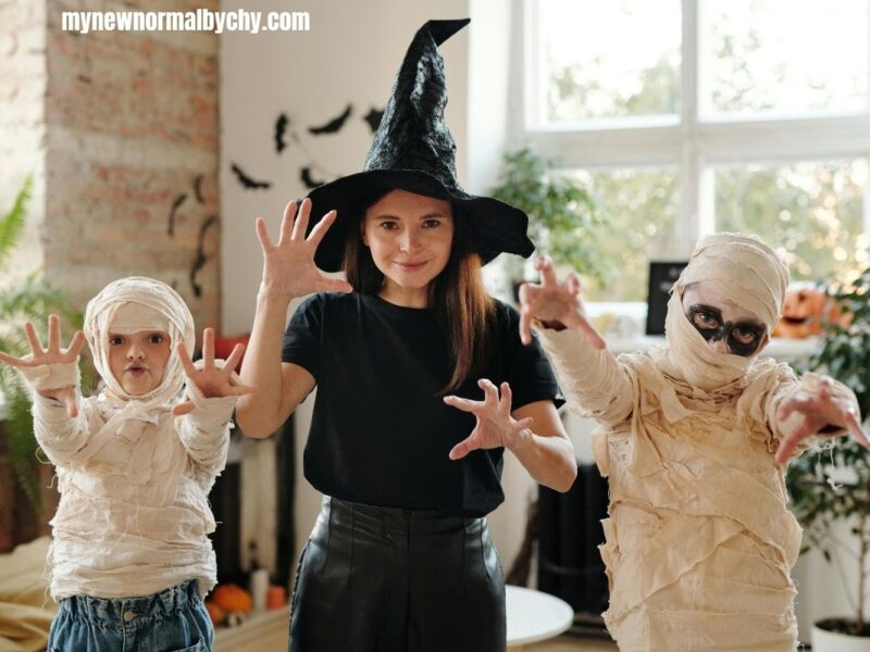 a-woman-and-two-kids-wearing-halloween-costumes