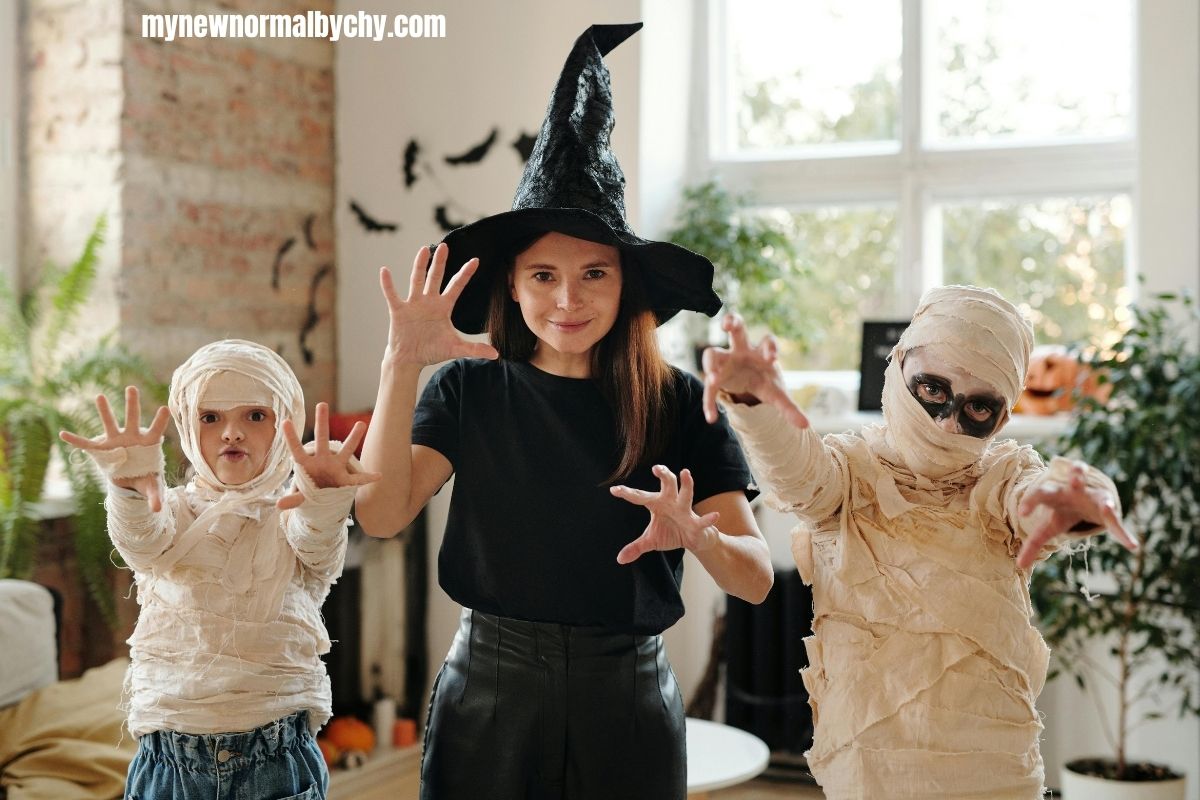 a-woman-and-two-kids-wearing-halloween-costumes