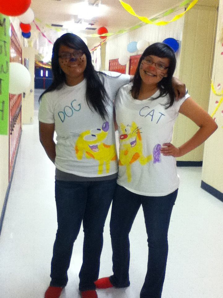 a-photo-of-two-ladies-on-white-branded-tshirts-and-black-trousers