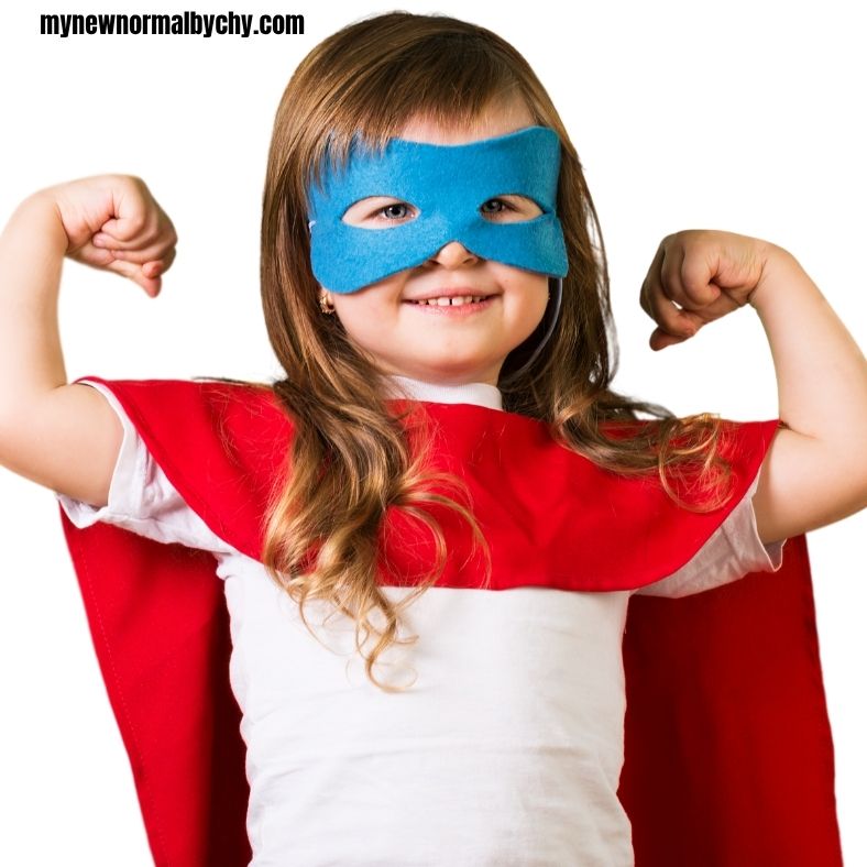 a-girl-aged-5-wearing-a-superhero-costume-blue-mask-a-red-cape-and-a-white-tshirts