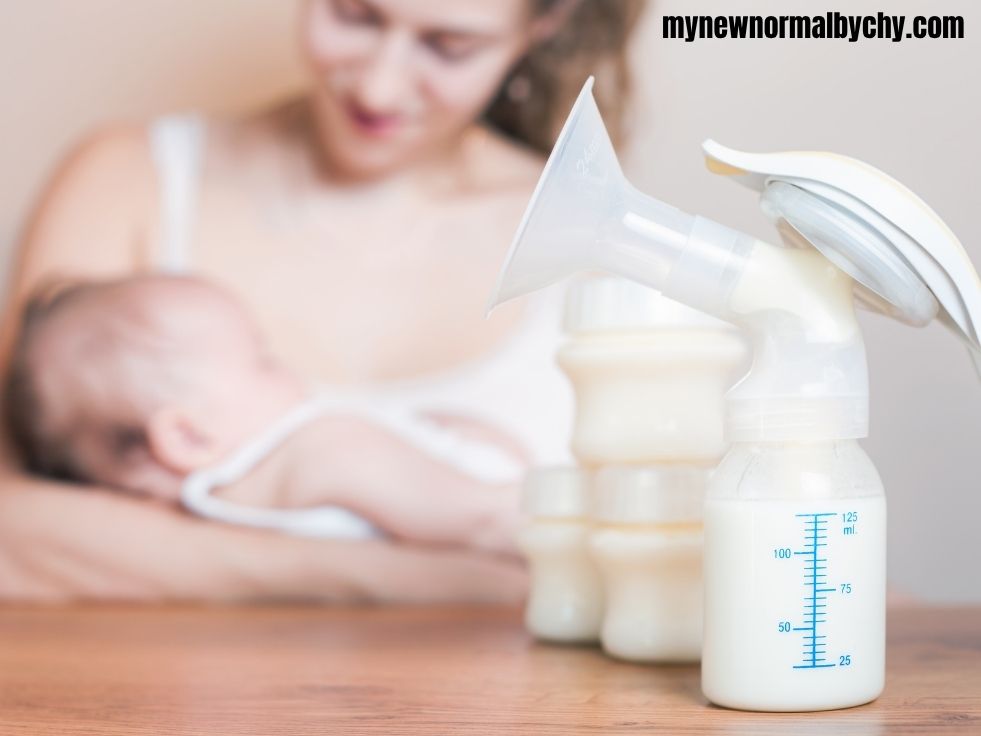 a-nursing-mother-feeding-her-baby-some-feeding-bottles-and-breast-pump-with-milk-in-them-on-the-table