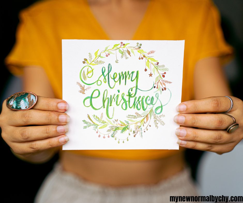 a-photo-of-a-woman-holding-a-Christmas-greeting-card