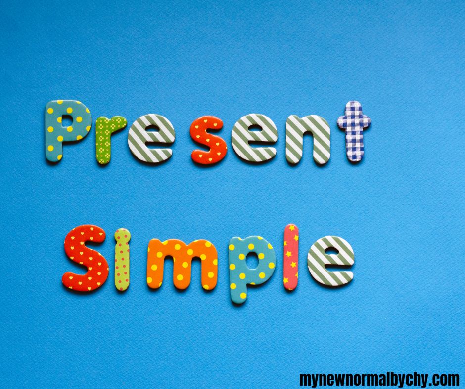 coloured-text-present-simple-on-blue-paper-background