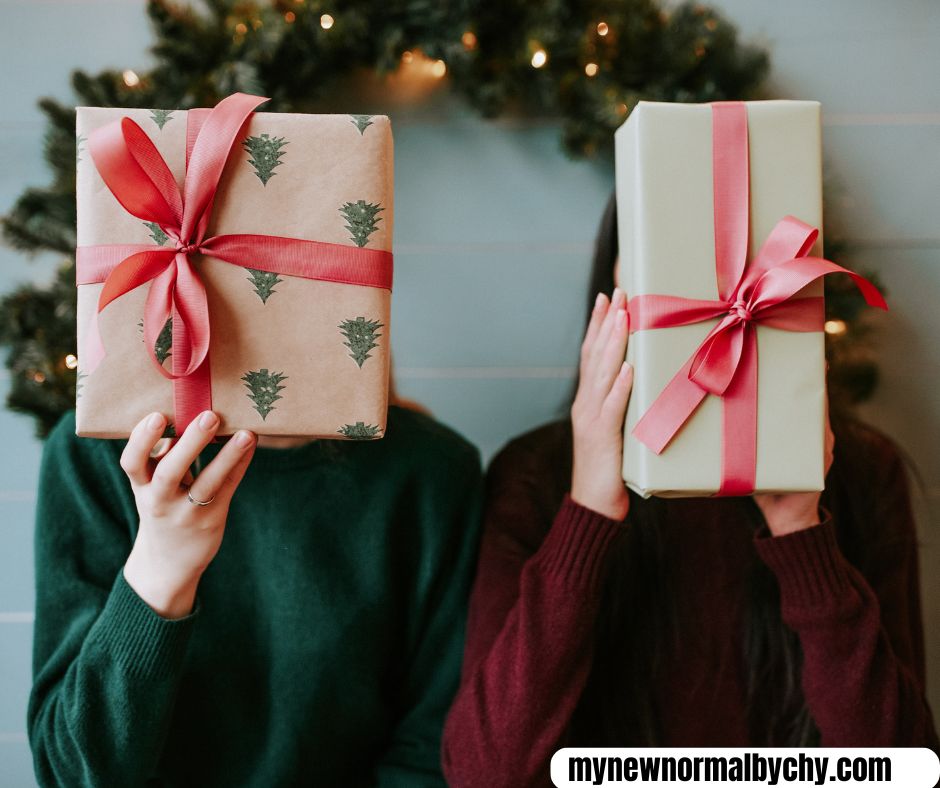 two-women-holding-up-gift-boxes