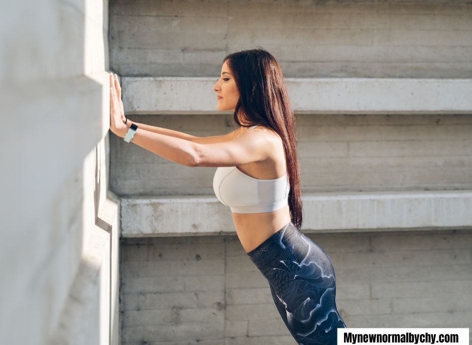 mid-aged-woman-doing-wall-push-ups-7-Safe-Postpartum-Workout-Routine-for-Beginners-After-Normal-Delivery