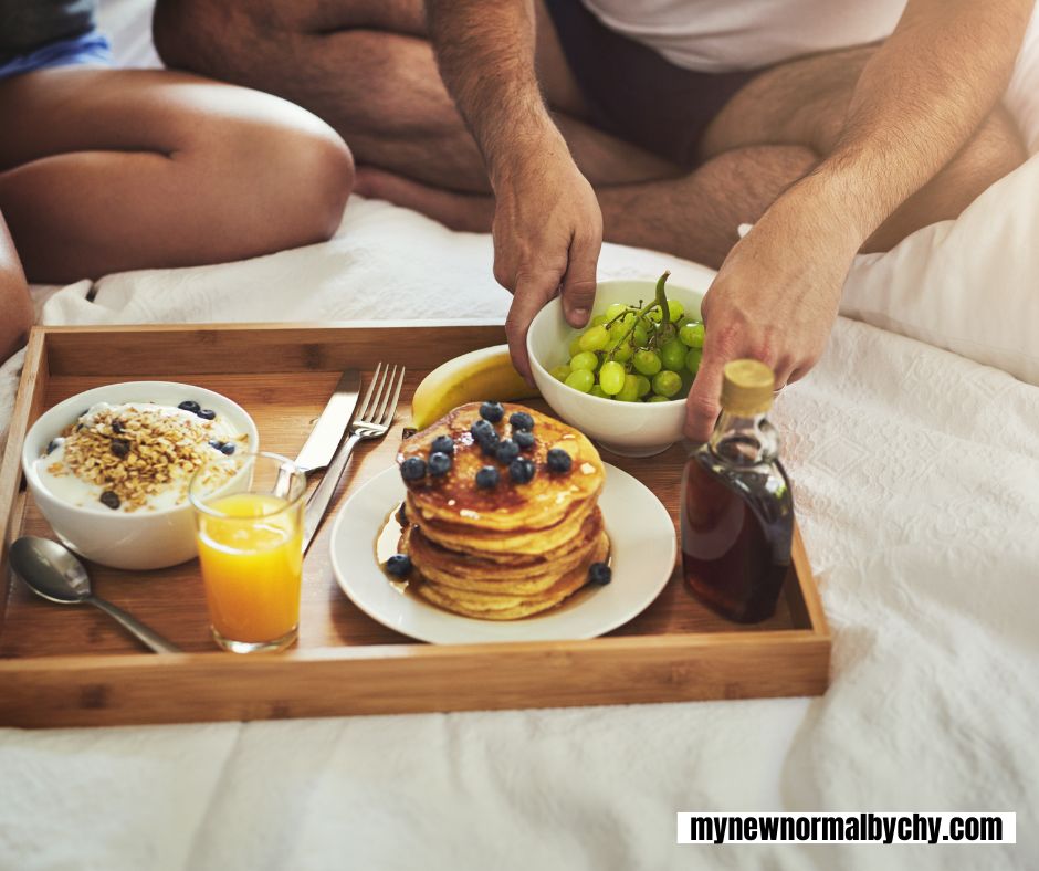 a-breakfast-food-tray-with-pancakes-oatmeal-and-grapes