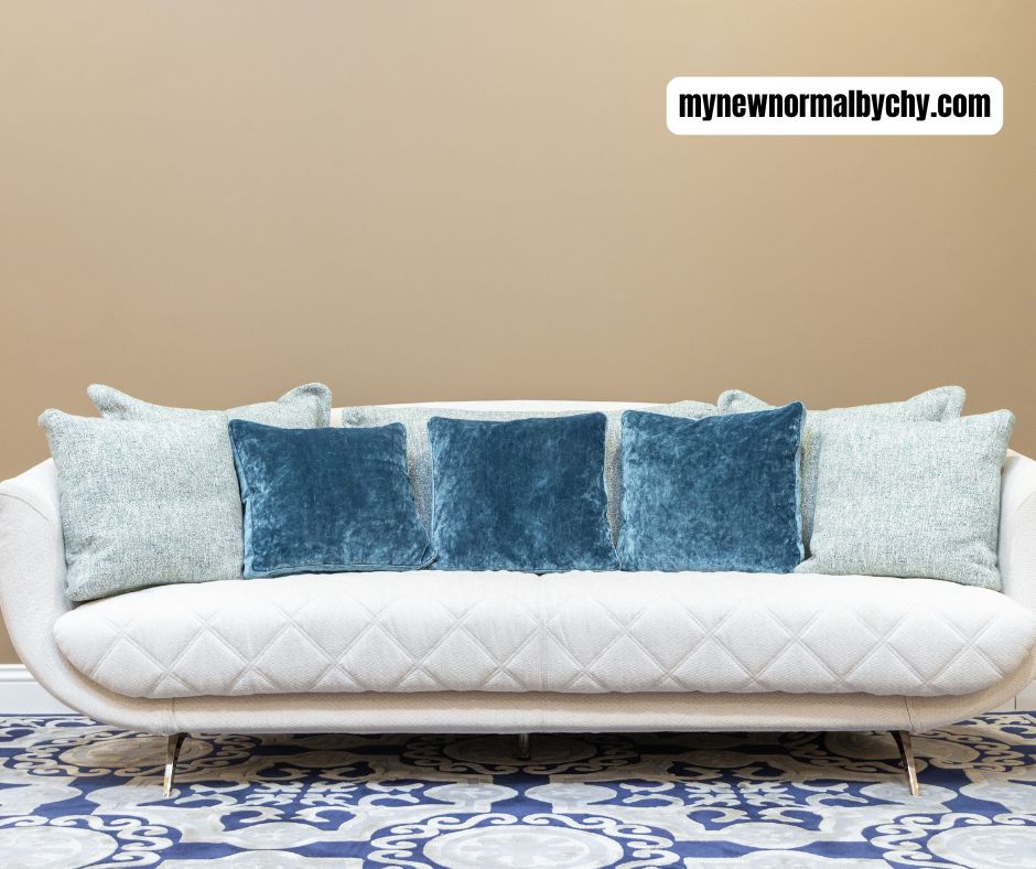 a-beige-sofa-with-throw-pillows-of-varied-texture-and-shapes