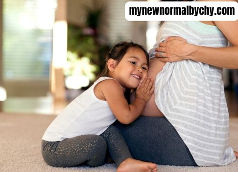 How-to-prepare-your-toddler-for-a-new-baby-toddler-listening-to-baby-kick