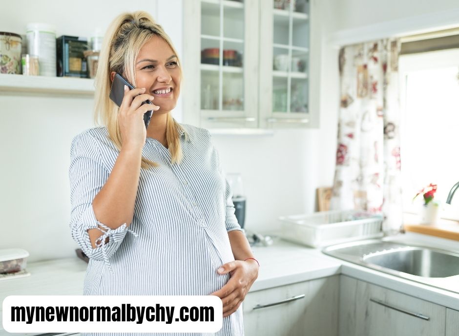 Pregnant-mom-on-the-phone-how-to-prepare-your-toddler-for-a-new-baby