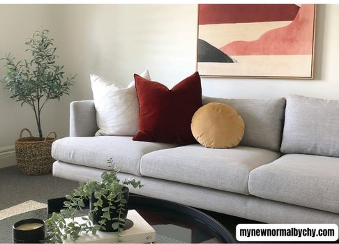 sofa-set-up-with-three-throw-pillows-two-squared-shape-and-one-rounded-How-to-Mix-and-Match-Throw-Pillow-Combinations-for-a-Cozy-Living-Room