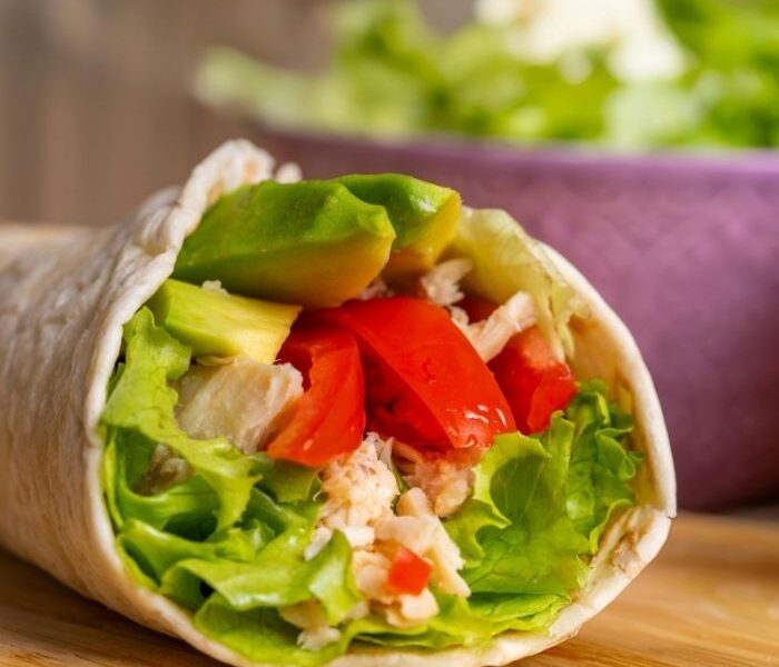 an-image-of-a-vegetable-wrap-on-a-wooden-table