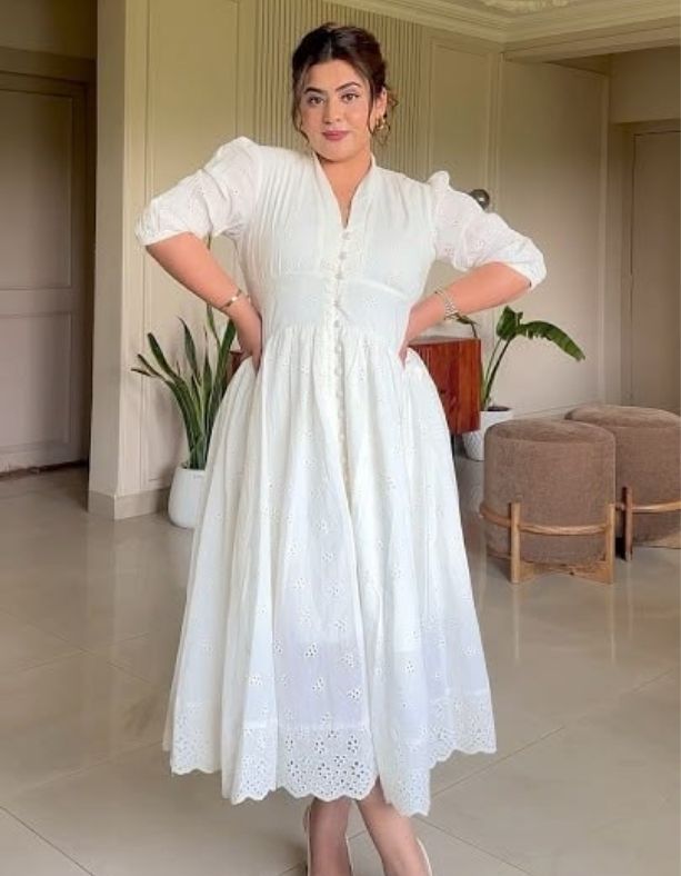 A-lady-wearing-a-white-empire-waist-maxi-dress-15-Comfortable-Postpartum-Outfits-That-Hide-the-Mom-Pooch-Beautifully