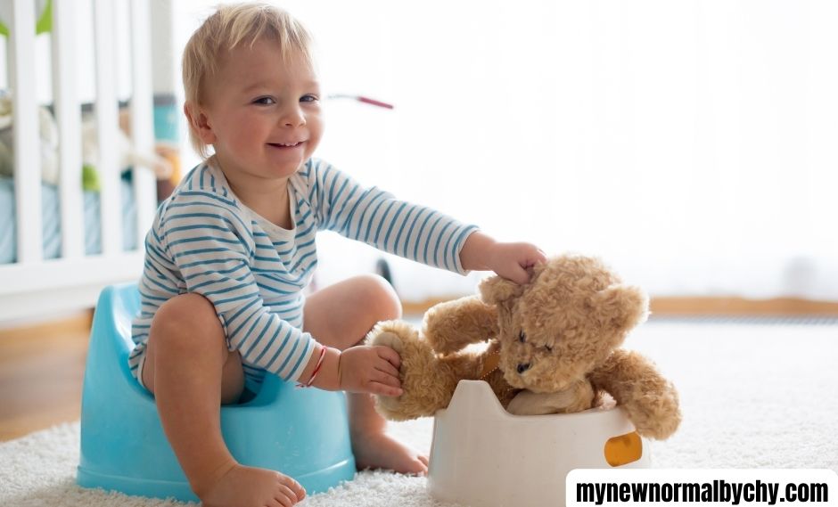 A-toddler-practicing-potty-training-with-a-stuffy-and-a-pretend-potty