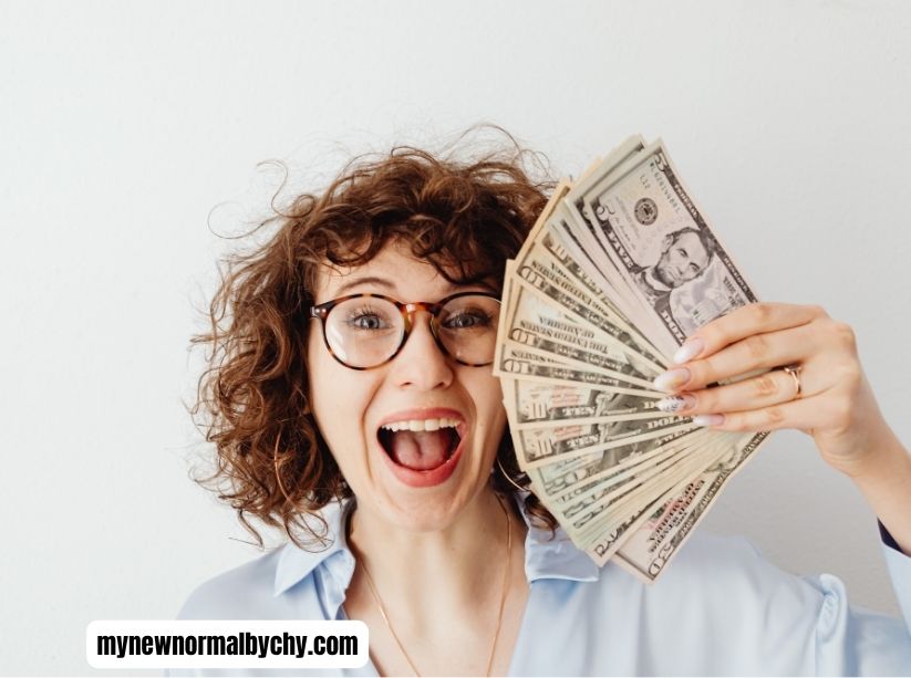 happy-teacher-holding-some-money