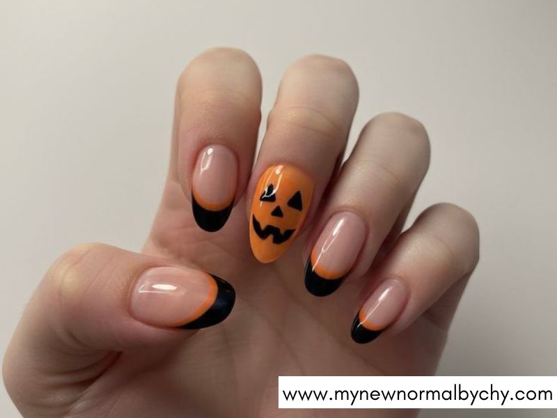 Pumpkin-Face-French-Tips-Cute-Halloween-Nails-You'll-Want-to-Copy-This-Spooky-Season